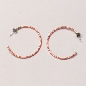 1.5" copper plated hoop earrings with butterfly back.